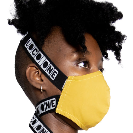 LOCO ONE REBOOT COLLECTION. MASKA CHANGE YELLOW. The Avant-garde LOCO ONE MASKA CHANGE in yellow is made of two layers of stretchy, soft COTTON. Adjustable woven straps on the neck with a plastic buckle for a better fit. You can wash it with soap and water in the comfort of your home every day to keep it nice and clean. The CDC recommends wearing face coverings in public places.