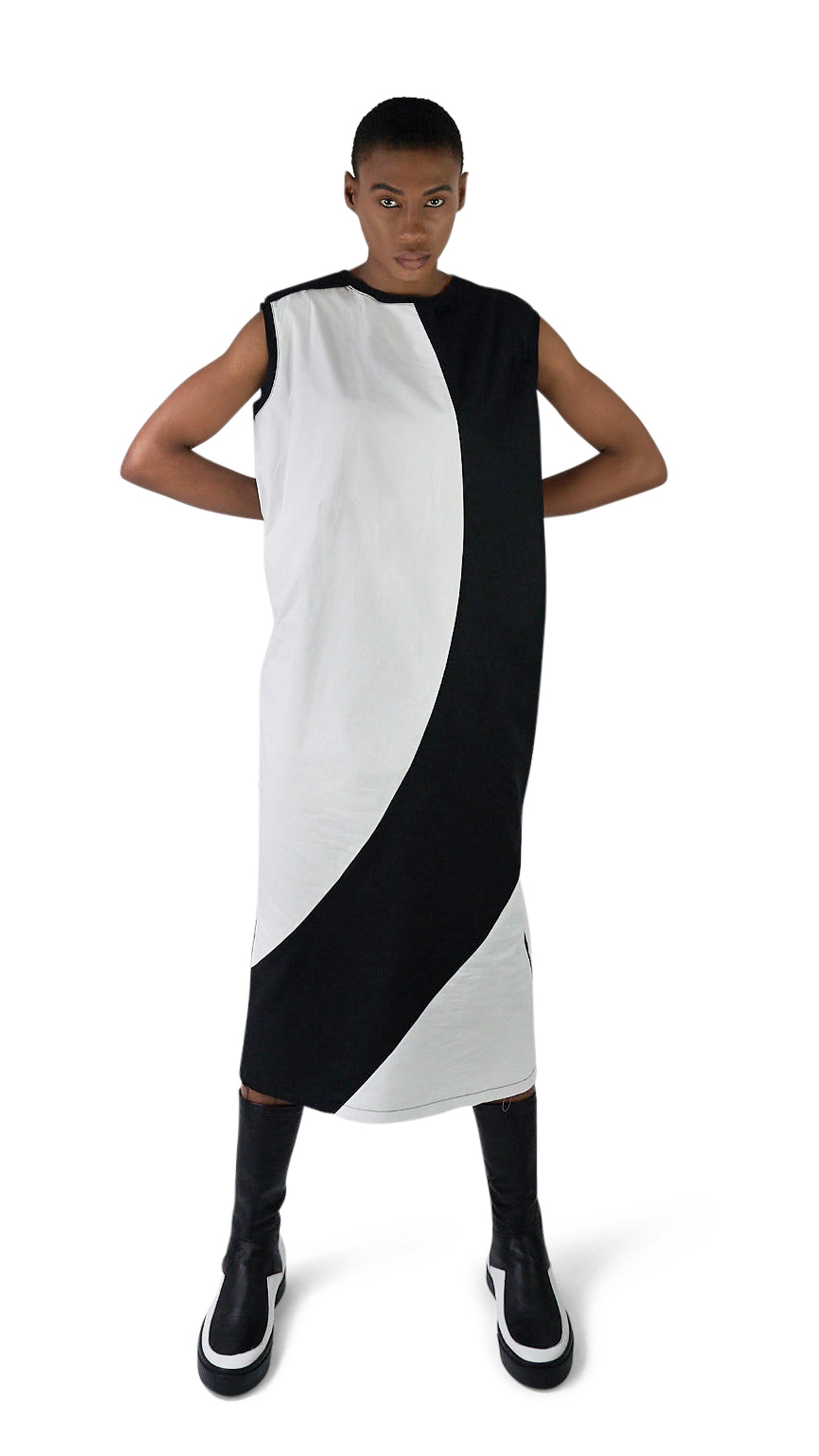 LOCO ONE ACHROMATIC COLLECTION.  DESIGN NUMERO 02.  Unisex dress made with natural materials only. Main composition is COTTON with neckline and sleeves details made of BAMBOO. Asymmetrical cuts, Futuristic look. Raw finishes on the front hem and a split in the back with a detailed, finished hem. Loose fit.