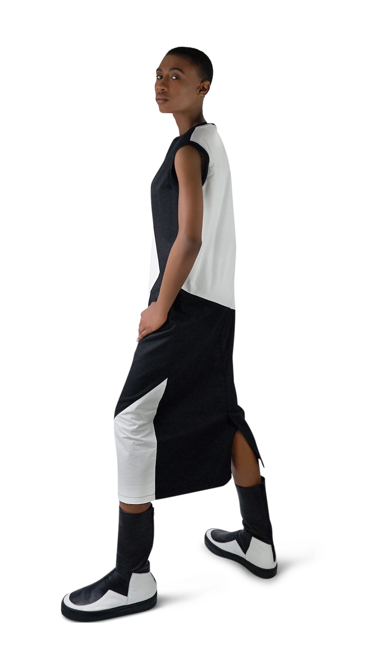 LOCO ONE ACHROMATIC COLLECTION.  DESIGN NUMERO 02.  Unisex dress made with natural materials only. Main composition is COTTON with neckline and sleeves details made of BAMBOO. Asymmetrical cuts, Futuristic look. Raw finishes on the front hem and a split in the back with a detailed, finished hem. Loose fit.