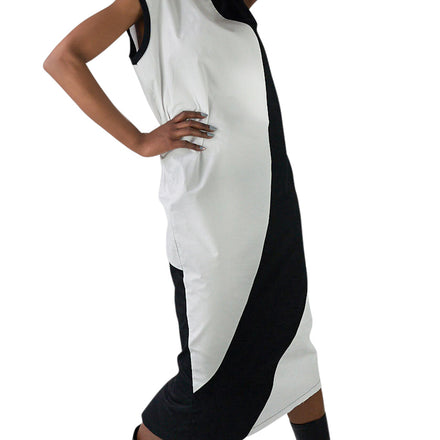 LOCO ONE ACHROMATIC COLLECTION.  DESIGN NUMERO 02.  Unisex dress made with natural materials only. Main composition is COTTON with neckline and sleeves details made of BAMBOO. Asymmetrical cuts, Futuristic look. Raw finishes on the front hem and a split in the back with a detailed, finished hem. Loose fit.