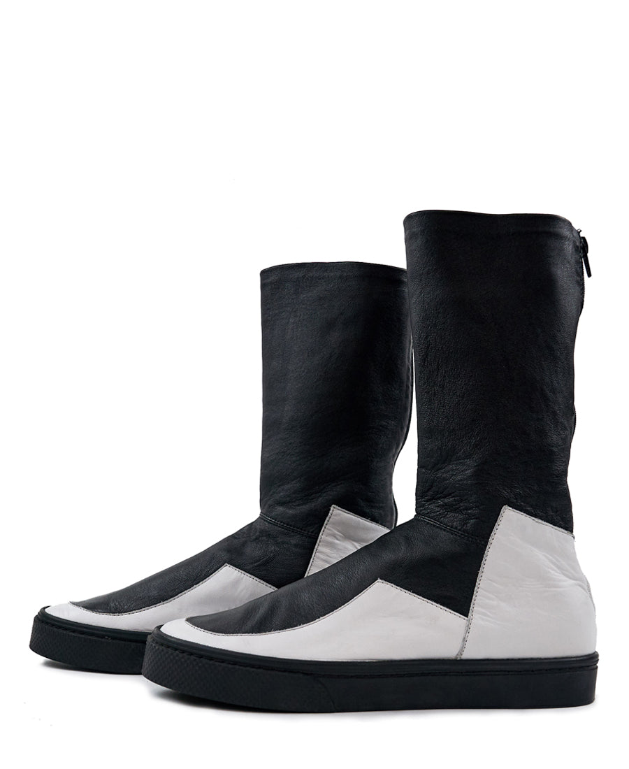 LOCO ONE ACHROMATIC COLLECTION.  BOOTS EQUILIBRIUM.  These are hand made Boots of Genuine Leather. The base of the boot is made of white Cow leather and the upper part and lining is made of black Lamb leather, with a black zipper on the back from mid ankle to top. The soles are made of black rubber glued and stitched. These have an Androgynous Style.