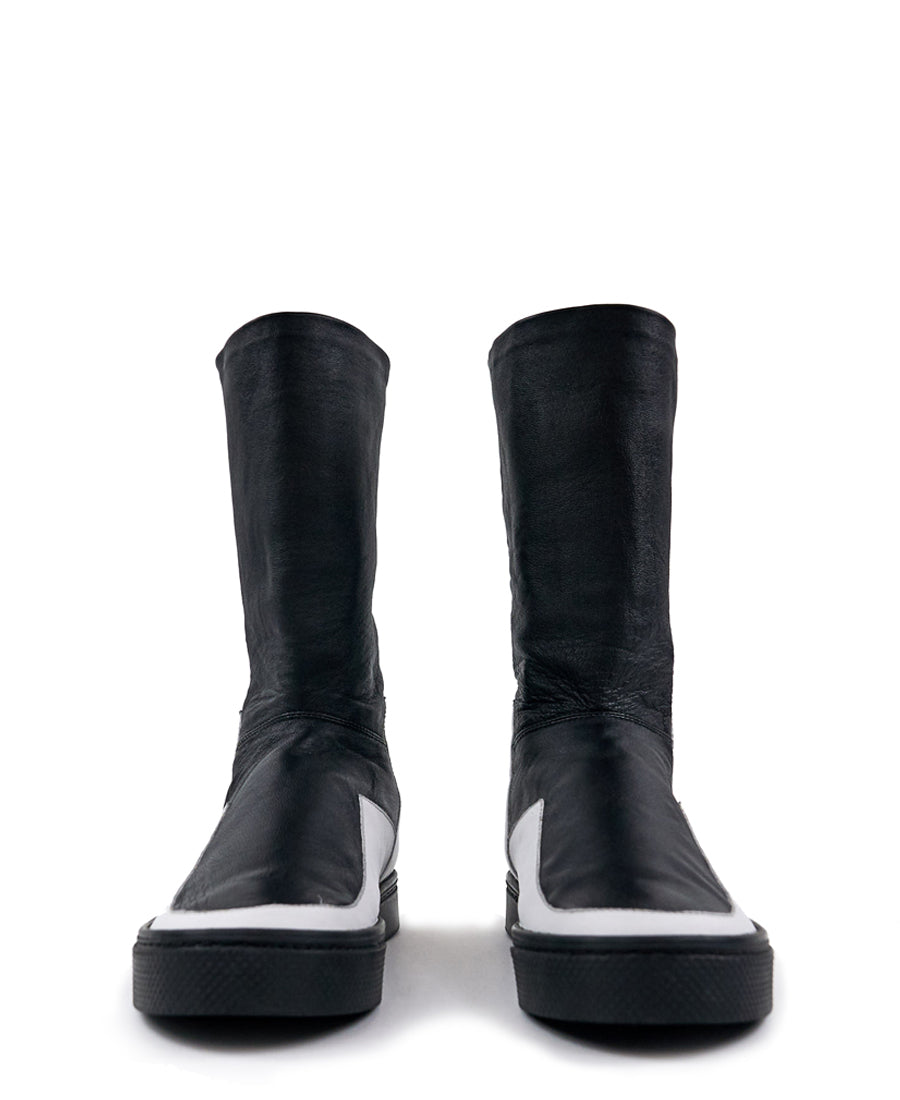 LOCO ONE ACHROMATIC COLLECTION.  BOOTS EQUILIBRIUM.  These are hand made Boots of Genuine Leather. The base of the boot is made of white Cow leather and the upper part and lining is made of black Lamb leather, with a black zipper on the back from mid ankle to top. The soles are made of black rubber glued and stitched. These have an Androgynous Style.