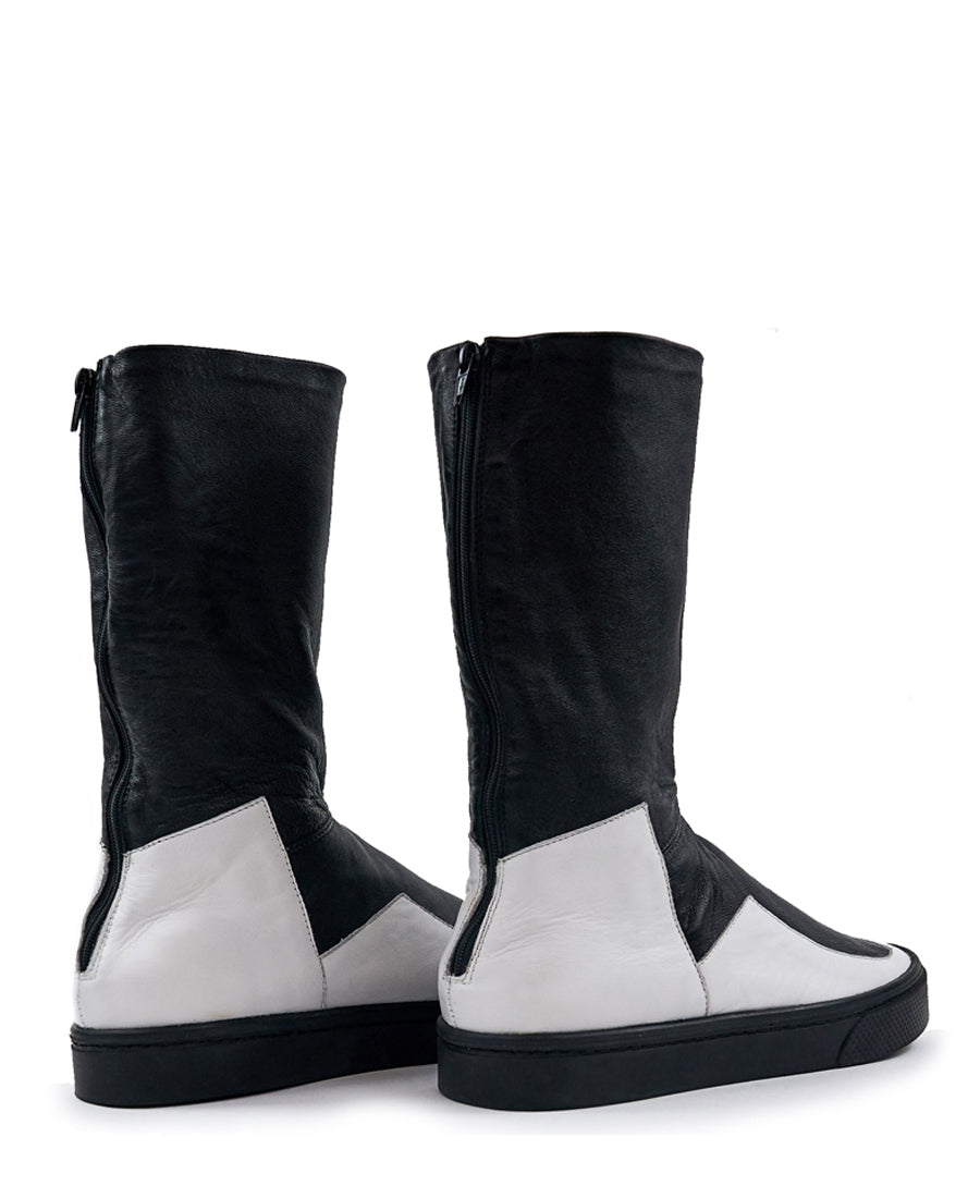 LOCO ONE ACHROMATIC COLLECTION.  BOOTS EQUILIBRIUM.  These are hand made Boots of Genuine Leather. The base of the boot is made of white Cow leather and the upper part and lining is made of black Lamb leather, with a black zipper on the back from mid ankle to top. The soles are made of black rubber glued and stitched. These have an Androgynous Style.